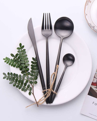 Black cutlery on a white plate