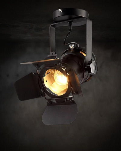 A ceiling lamp in a camera shape on black background