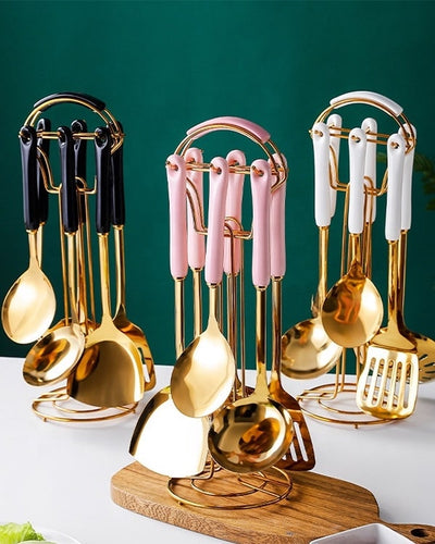 Sets of kitchen utensils in a kitchen with matte single colors and gold finish